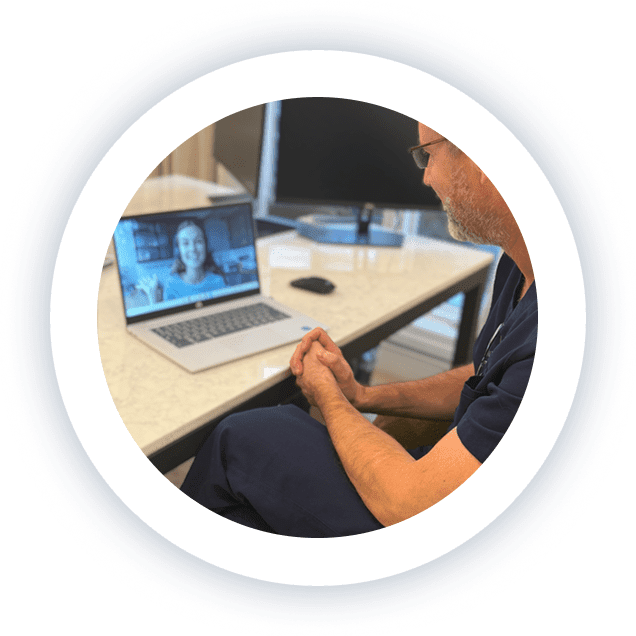 Doctor speaking to a patient on a video appointment from his medical office, providing personalized care to patients in Edina, Minnesota