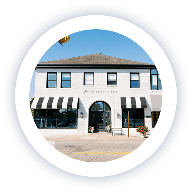 Exterior view of a modern two-story building at 4388 France Ave S, home to Lite Medical in Edina, Minnesota. Storefronts with white brick, black awnings, and large street-facing windows.