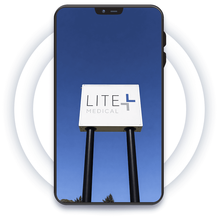 Lite Medical building's sign in Plymouth, MN against clear blue sky.