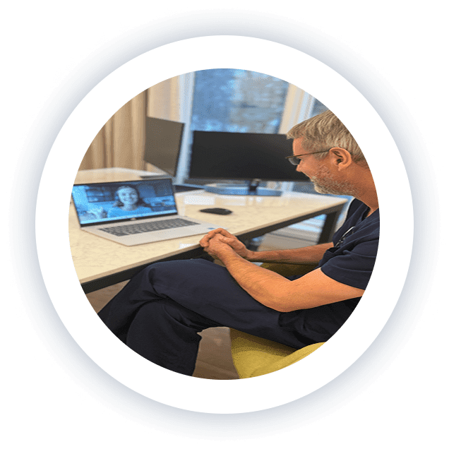 Dr. Kyle Kingsley, MD, speaking to a patient on a video appointment from his medical office, providing personalized care to patients in Edina, Minnesota